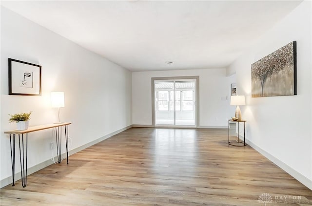 empty room with light hardwood / wood-style floors