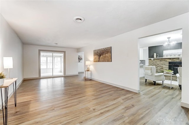 interior space featuring light hardwood / wood-style flooring and a chandelier