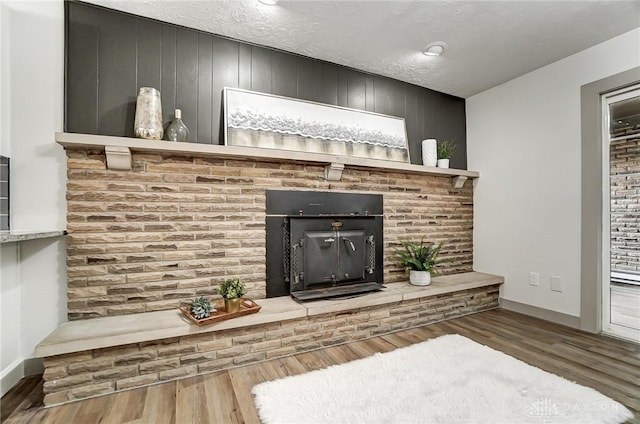 room details featuring wood-type flooring and a textured ceiling