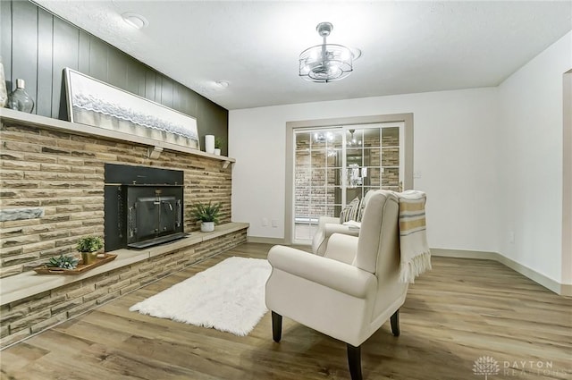 living room featuring a fireplace and light wood-type flooring