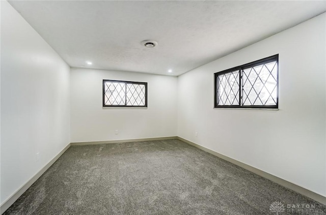 unfurnished room with carpet flooring