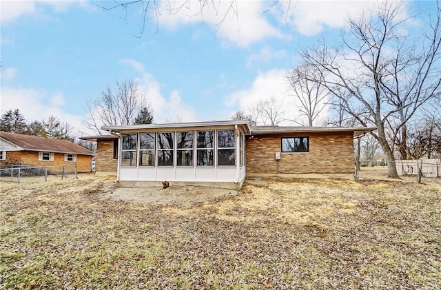 rear view of house with a sunroom