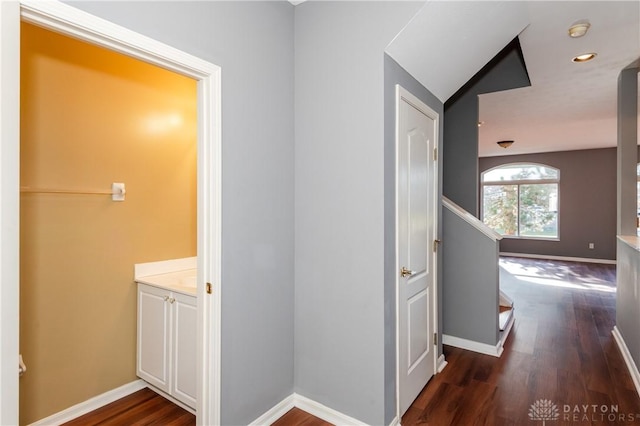 hallway featuring dark wood-type flooring