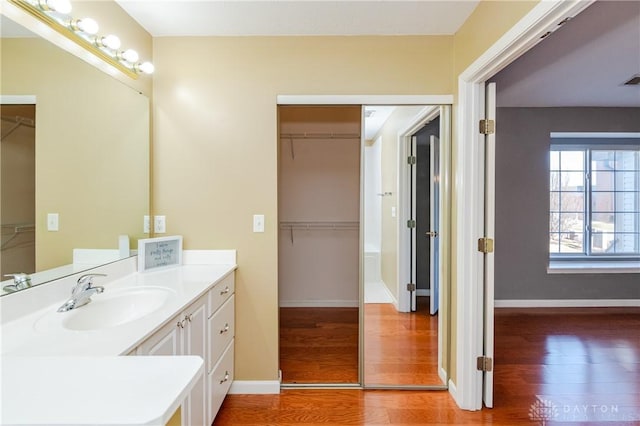 bathroom featuring vanity and hardwood / wood-style floors