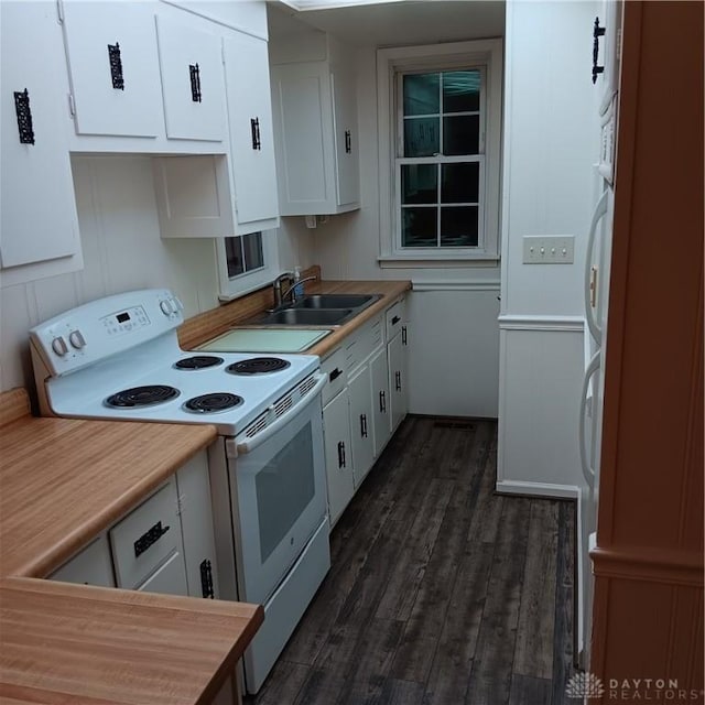 kitchen featuring white cabinetry, sink, white electric range, and dark wood-type flooring