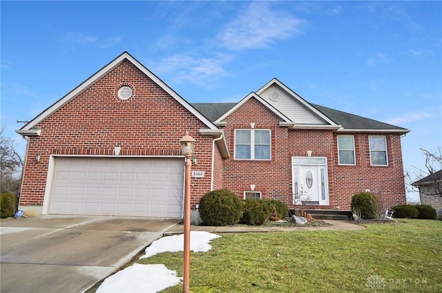 view of front of property featuring a garage and a front lawn