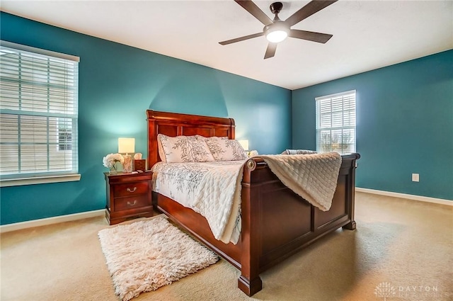 bedroom with light colored carpet and ceiling fan