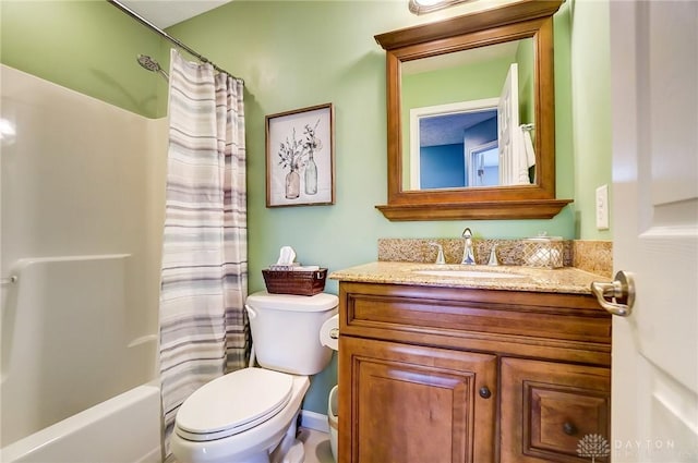 full bathroom featuring vanity, shower / bath combo with shower curtain, and toilet