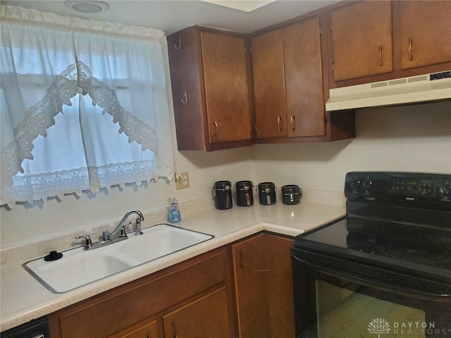 kitchen with black range with electric stovetop and sink