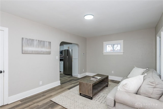 living room with dark hardwood / wood-style floors