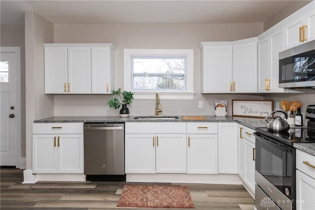 kitchen featuring white cabinetry, appliances with stainless steel finishes, and sink