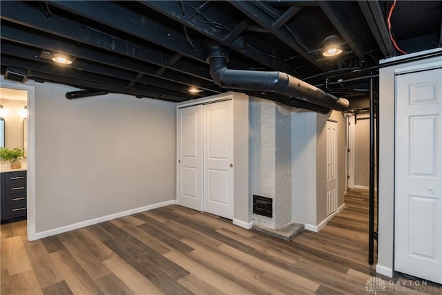 basement featuring hardwood / wood-style floors