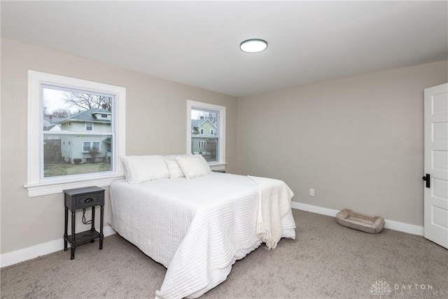 bedroom with light carpet