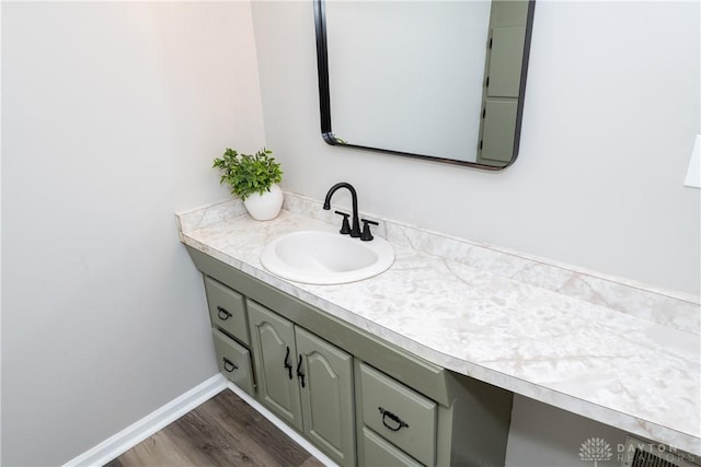 bathroom featuring vanity and hardwood / wood-style floors