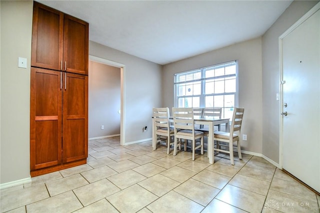 dining area with light tile patterned floors