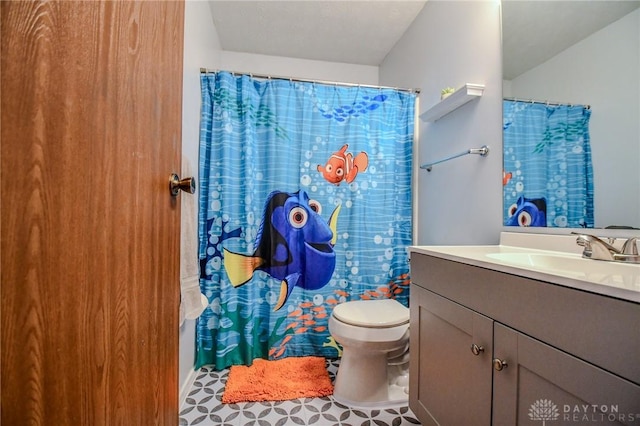 bathroom with vanity and toilet