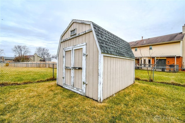 view of outbuilding featuring a yard