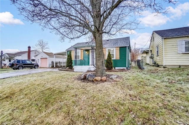 view of front of house with a front yard and a carport