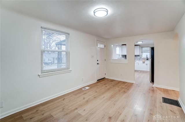 entrance foyer with light wood-type flooring