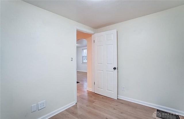 spare room with light hardwood / wood-style flooring