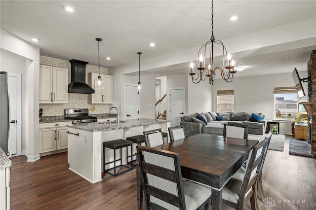 dining room featuring dark hardwood / wood-style floors and sink