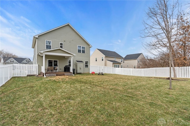 rear view of house with a lawn