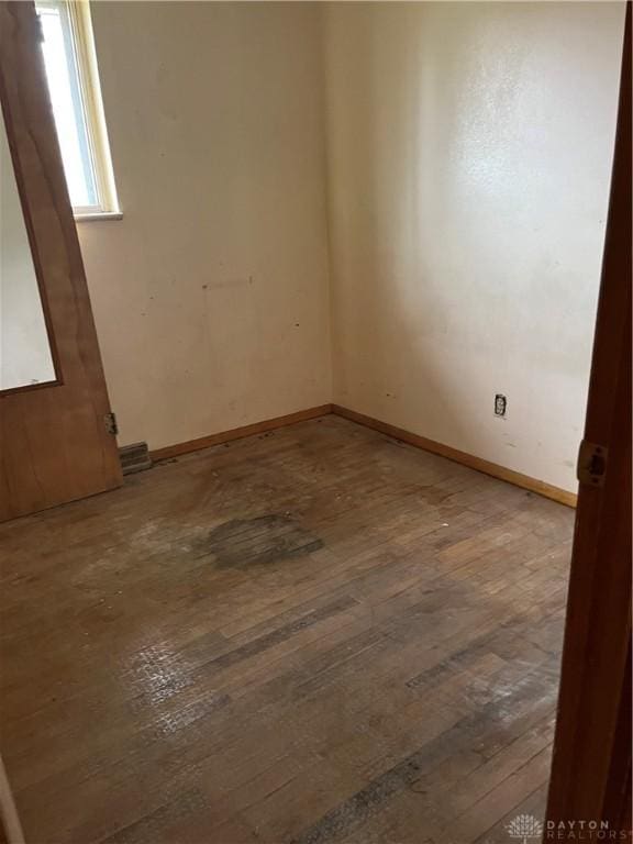 empty room with wood-type flooring