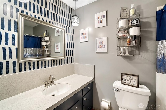 bathroom with vanity and toilet