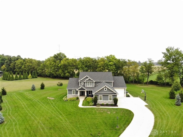 view of front of house with a garage and a front yard