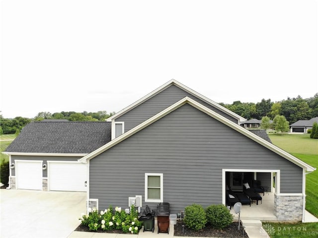 view of side of property featuring a patio area