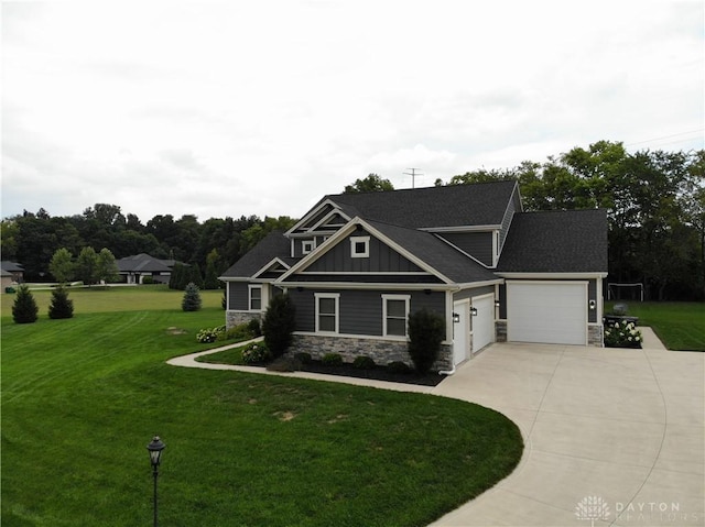 craftsman-style house featuring a garage and a front yard