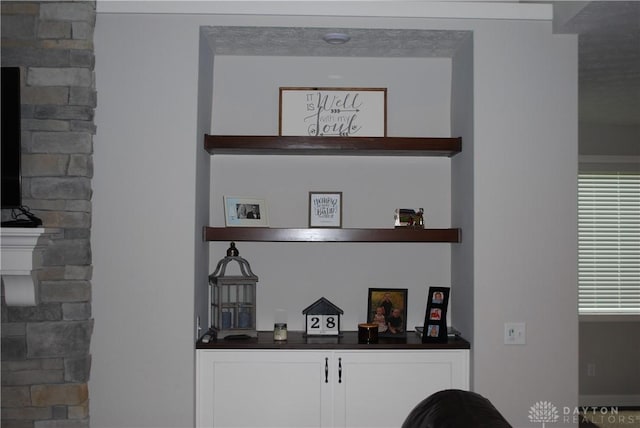 bar with white cabinetry