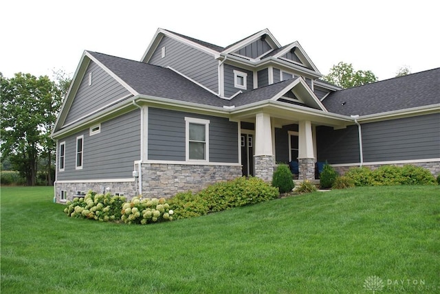 craftsman house with a front lawn