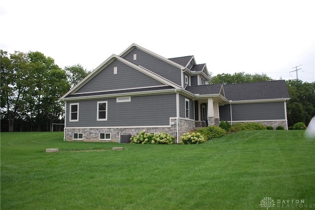 exterior space with a yard and central air condition unit