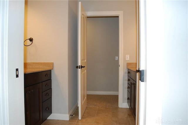 bathroom with tile patterned floors and vanity