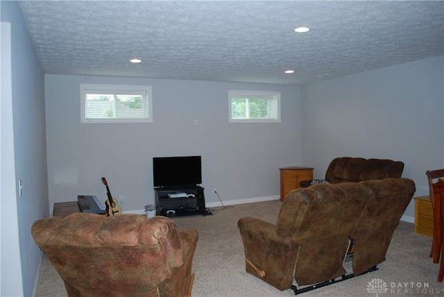 living room with light carpet and a textured ceiling