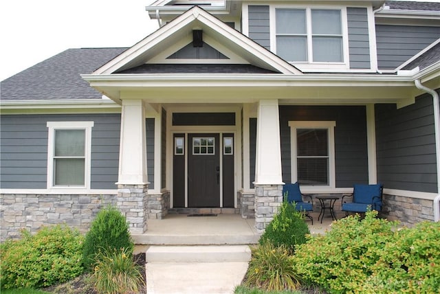 doorway to property featuring covered porch