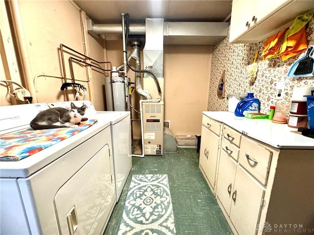 laundry room with cabinets and washer and clothes dryer