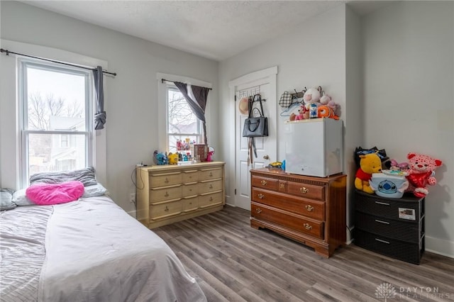 bedroom with hardwood / wood-style flooring