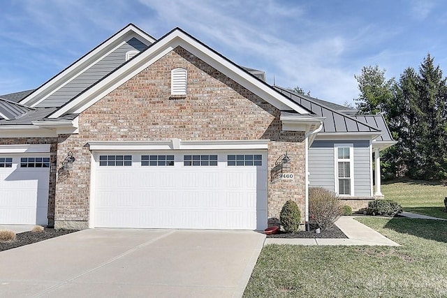 9460 Banyan Ct, Centerville, OH 45458 - view of front of house with metal roof, a garage, concrete driveway, and a standing seam roof