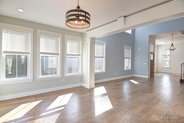 9460 Banyan Ct, Centerville, OH 45458 - interior space featuring a notable chandelier, dark wood finished floors, recessed lighting, baseboards, and ornate columns