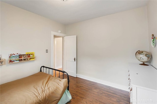 bedroom featuring dark hardwood / wood-style floors