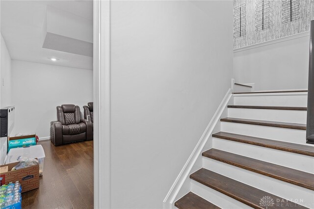 stairway featuring hardwood / wood-style floors