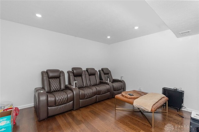 cinema featuring dark hardwood / wood-style flooring