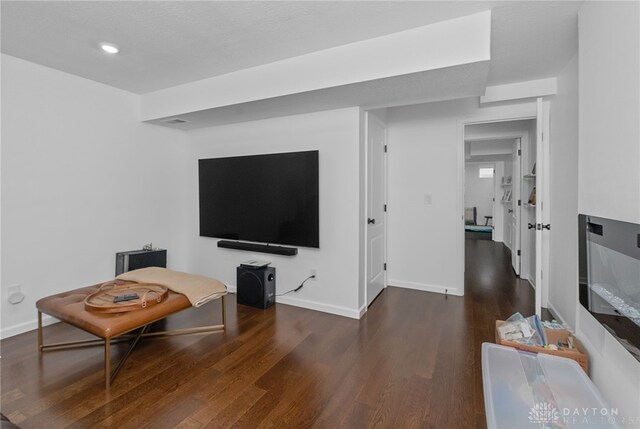 living room with dark hardwood / wood-style floors