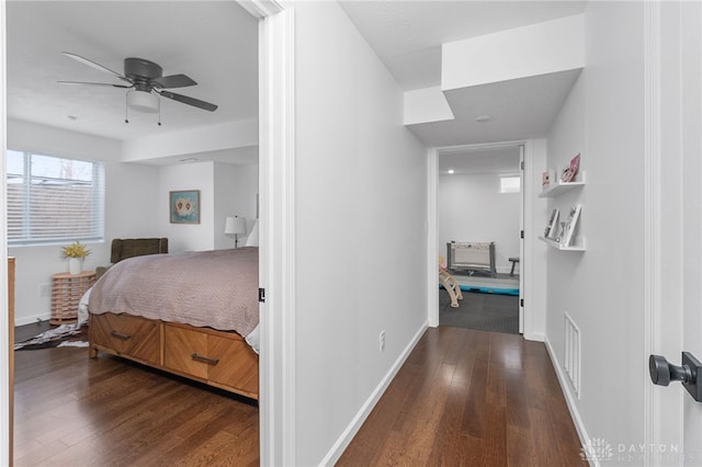 bedroom featuring dark wood-type flooring and ceiling fan