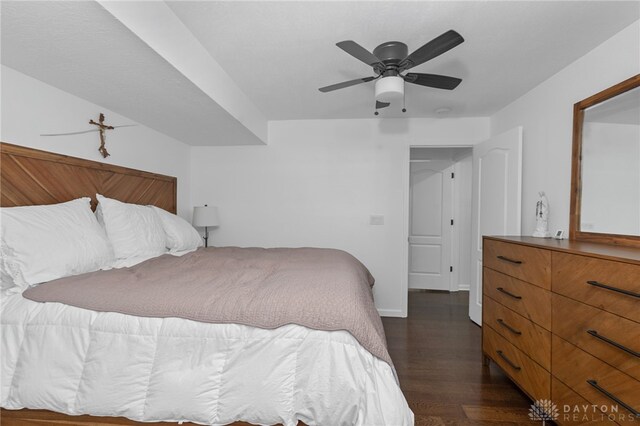 bedroom featuring ceiling fan and dark hardwood / wood-style flooring