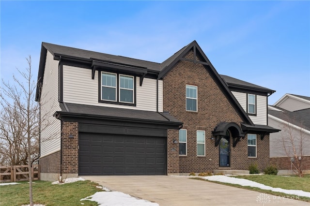 view of front of property with a garage and a front yard