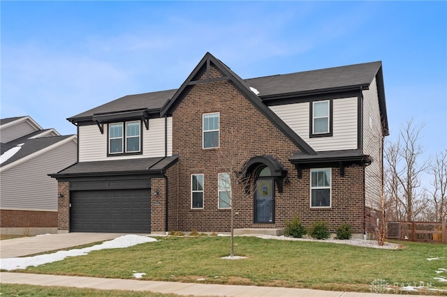 view of front of property with a garage and a front lawn