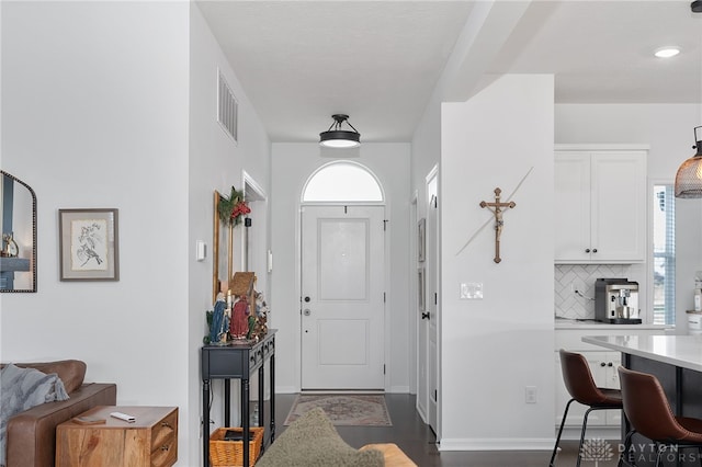 foyer entrance featuring dark hardwood / wood-style floors